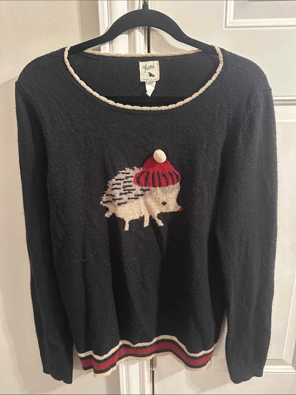 Yumi Black Crewneck Sweater with Cream Hedgehog and Red Pom Hat